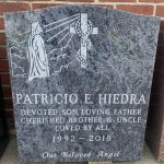 Upright Bahama Blue Monument with a picture of Jesus looking at a cross