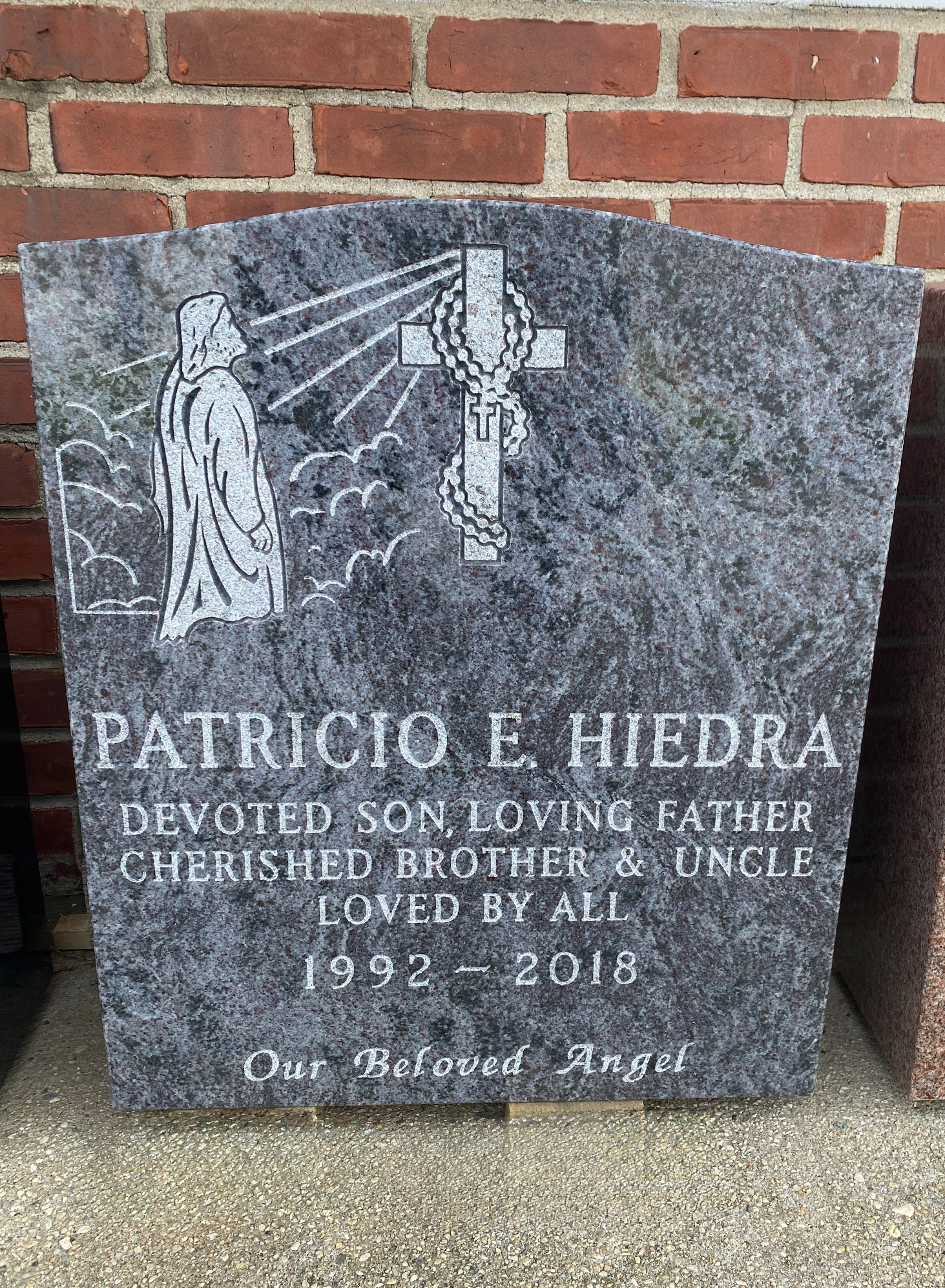 Upright Bahama Blue Monument with a picture of Jesus looking at a cross