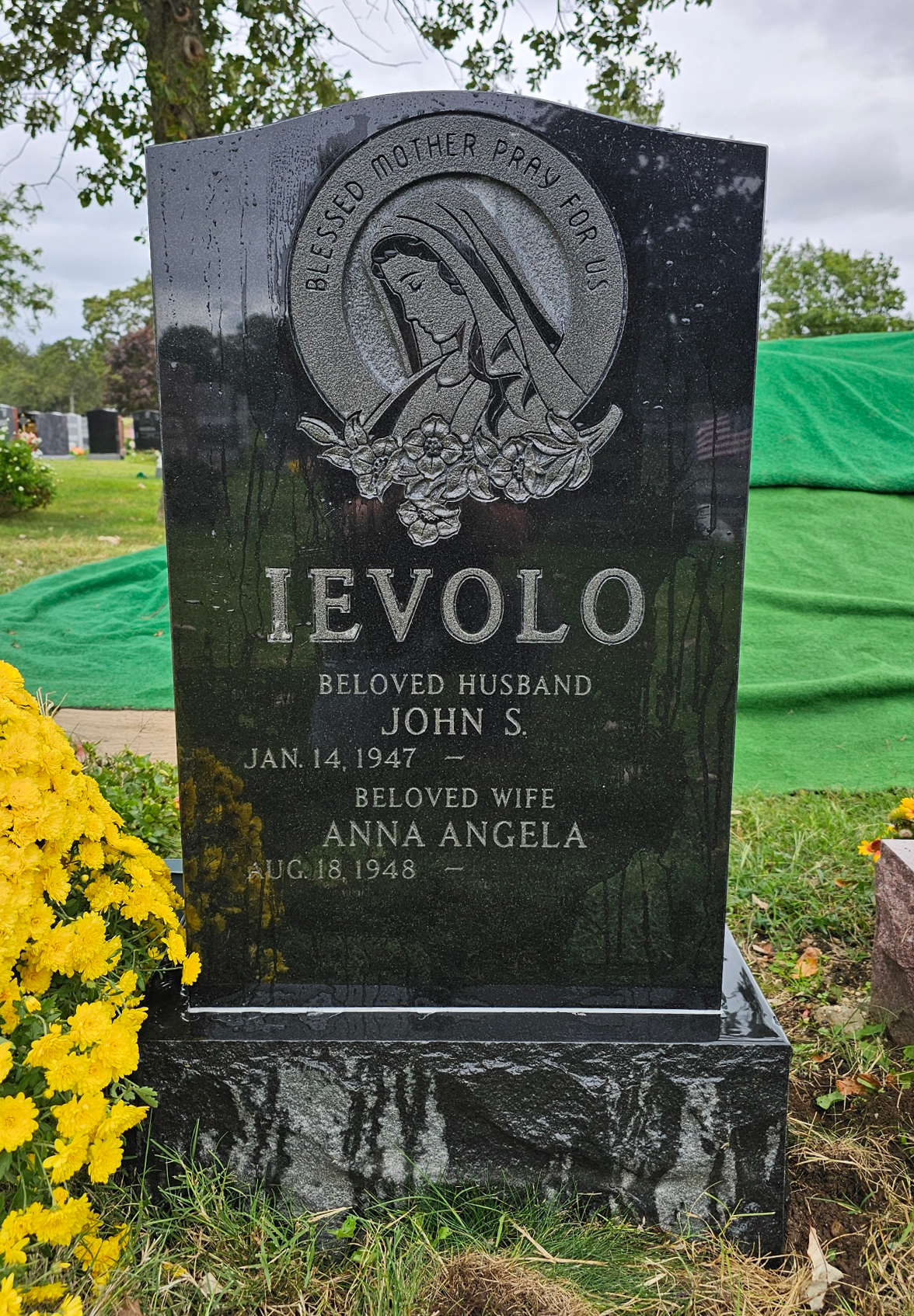 Upright Jet Black Mist Granite Monument with the Blessed Mother